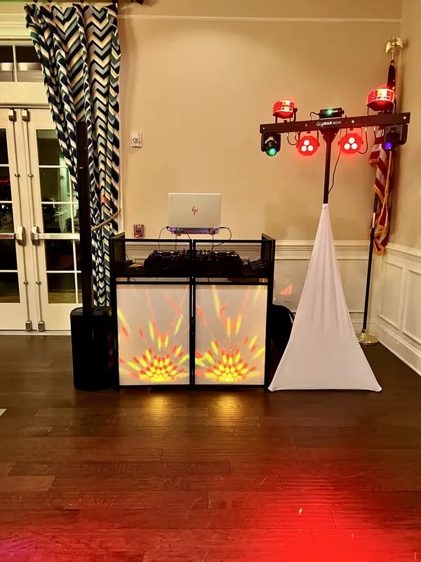 Chris James DJ booth with amber facade lighting