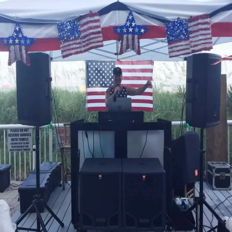 Poolside DJ stage decorated for the Fourth of July