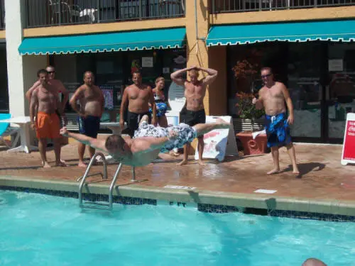 Contestants lined up at the pool edge